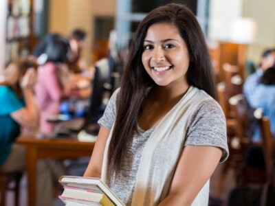 A student girl is smiling